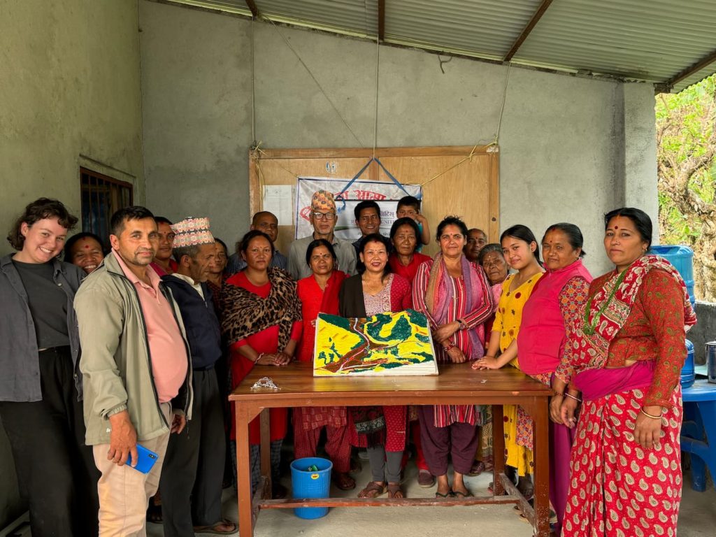 Community members in Nepal creating a 3D map to understand their landscape and water resources
