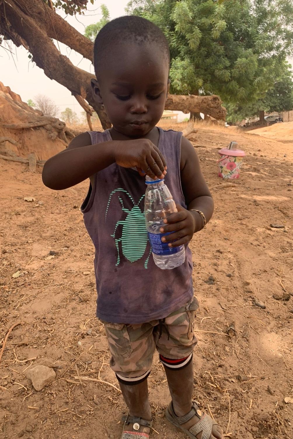 child drinking water senegal